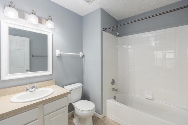 full bathroom with  shower combination, tile patterned flooring, vanity, a textured ceiling, and toilet