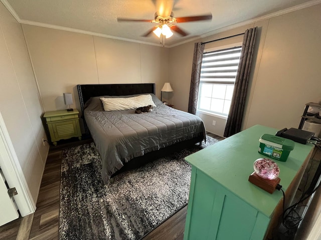 bedroom with dark hardwood / wood-style flooring, crown molding, and ceiling fan