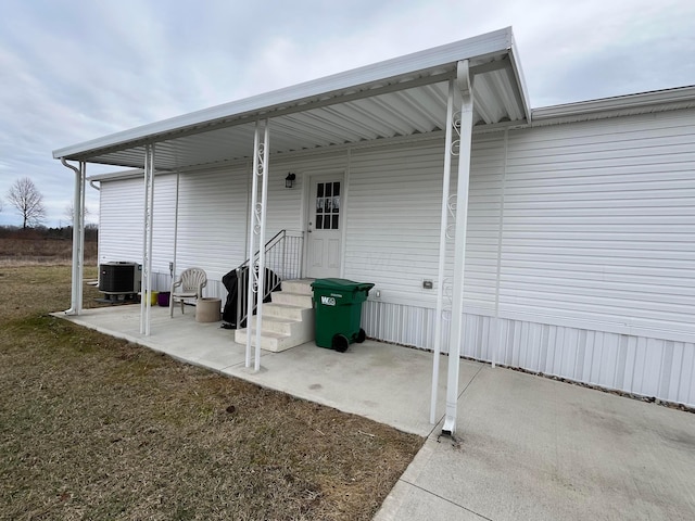 exterior space with a lawn and central air condition unit