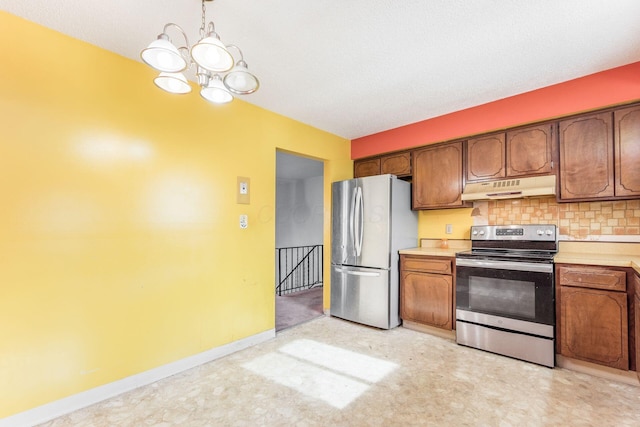 kitchen with pendant lighting, a notable chandelier, decorative backsplash, and appliances with stainless steel finishes