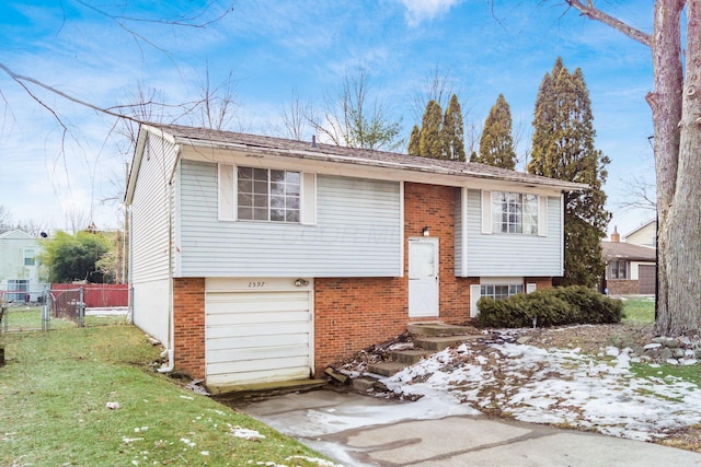 bi-level home featuring a garage