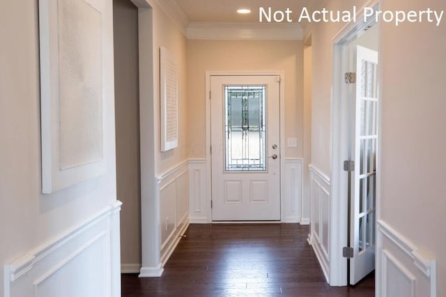 doorway with crown molding and dark wood-type flooring