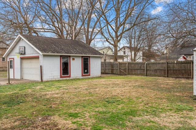 view of yard with a garage and an outdoor structure