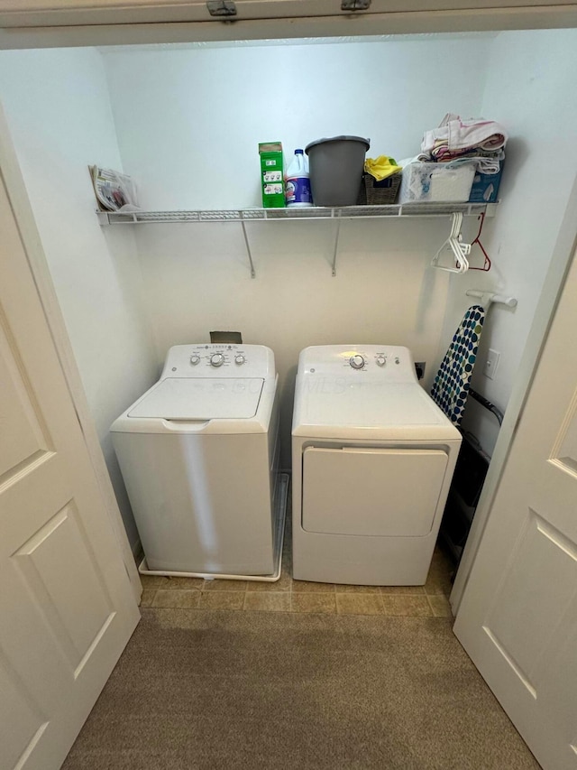 laundry room with washer and clothes dryer