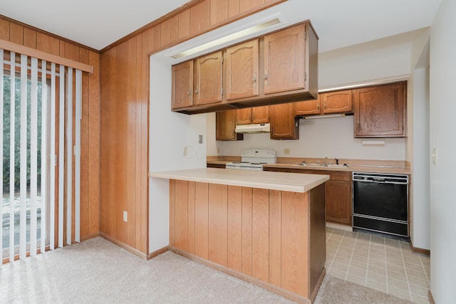 kitchen with white range with electric stovetop, black dishwasher, kitchen peninsula, and wood walls