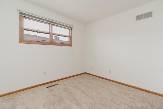 empty room featuring carpet flooring