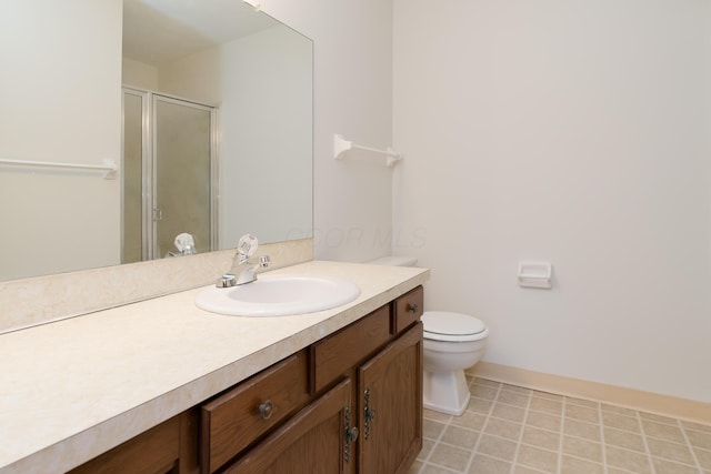 bathroom with vanity, toilet, an enclosed shower, and tile patterned flooring