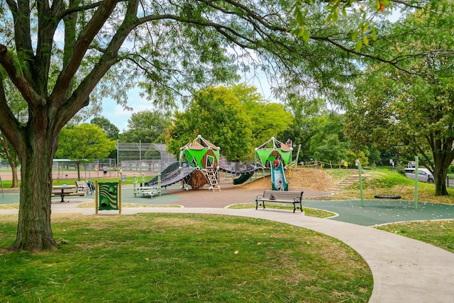 surrounding community with a yard and a playground