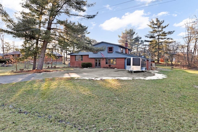 view of property exterior with a lawn