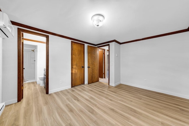 unfurnished bedroom featuring a baseboard radiator, a wall mounted AC, ornamental molding, light hardwood / wood-style floors, and ensuite bath