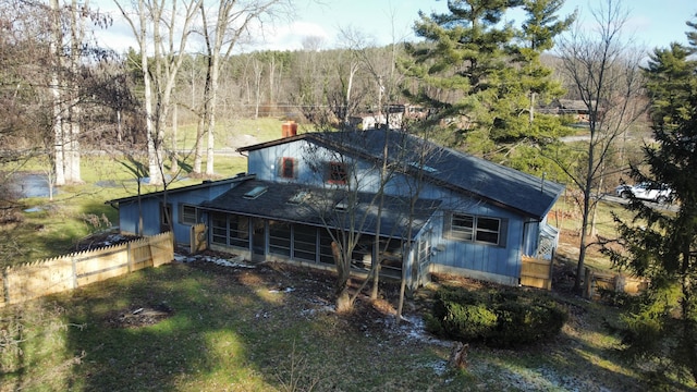 back of house featuring a sunroom