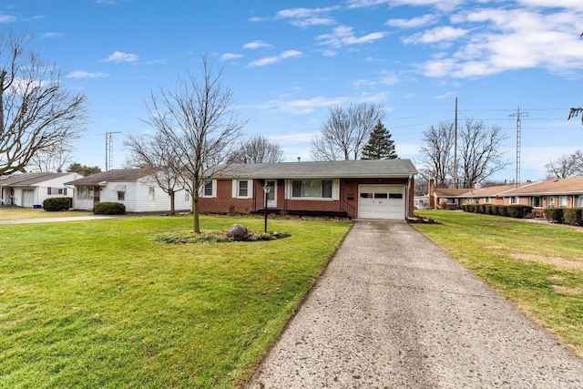 ranch-style home featuring a garage and a front lawn