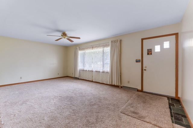 entryway with carpet flooring and ceiling fan