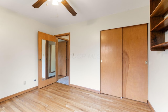 unfurnished bedroom featuring a closet, ceiling fan, and light wood-type flooring