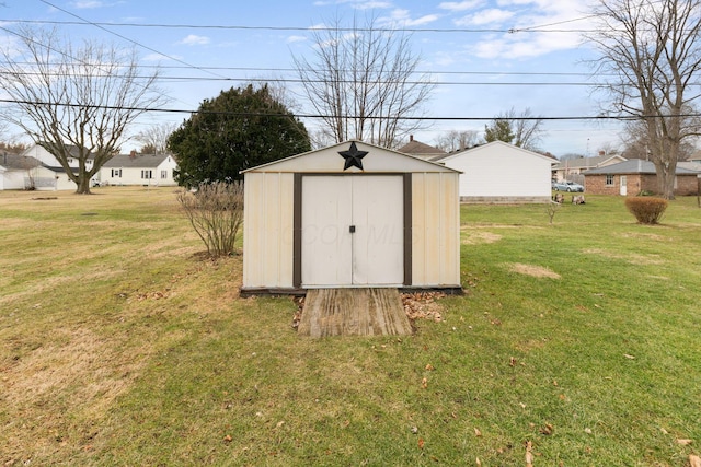 view of outbuilding featuring a yard