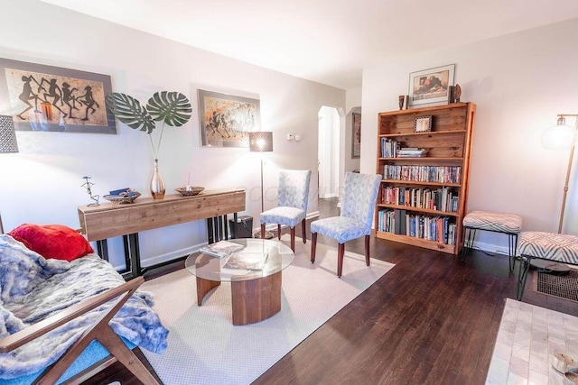 sitting room with dark hardwood / wood-style flooring