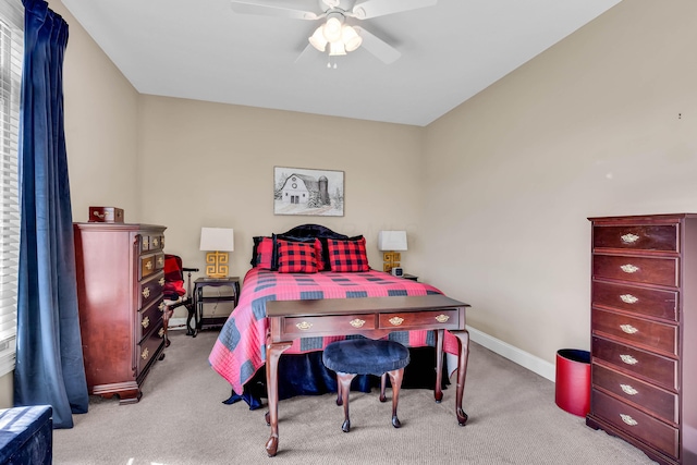 bedroom featuring light colored carpet and ceiling fan