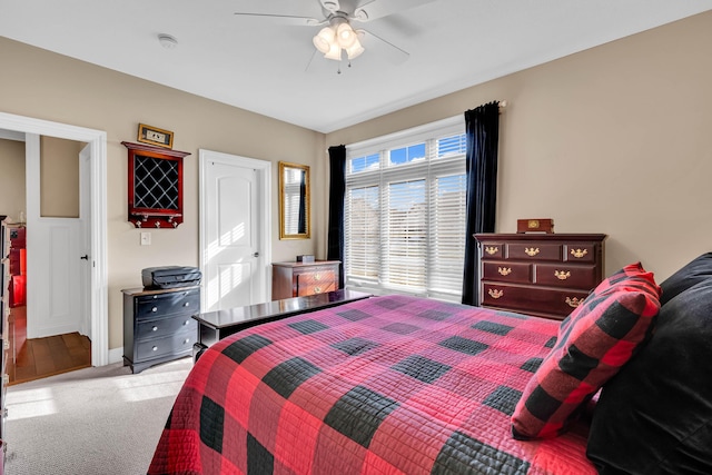 carpeted bedroom with ceiling fan