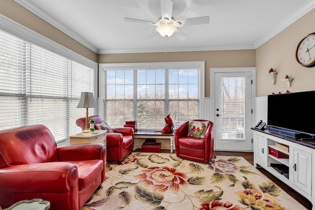 living room featuring crown molding and ceiling fan