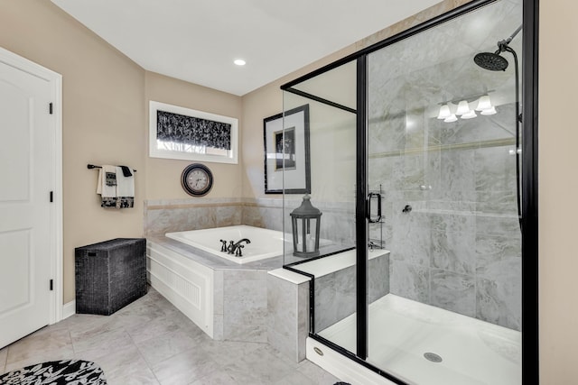 bathroom with separate shower and tub