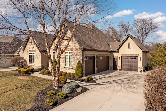 view of front of property featuring a garage and a front yard