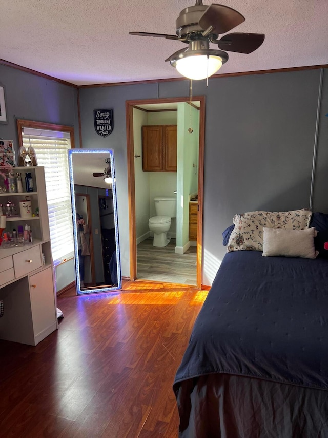 bedroom featuring crown molding, hardwood / wood-style flooring, a textured ceiling, and ensuite bathroom