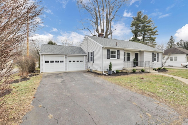 view of front of home featuring a garage and a front yard