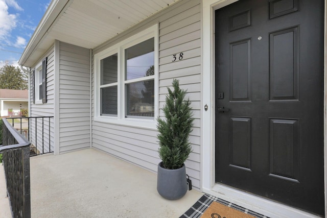 doorway to property featuring a porch