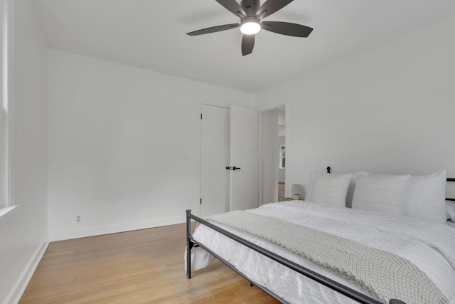 bedroom with hardwood / wood-style flooring and ceiling fan