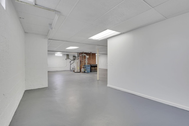 basement with a paneled ceiling