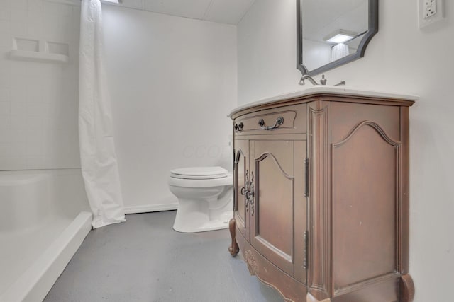 bathroom featuring vanity, curtained shower, concrete floors, and toilet