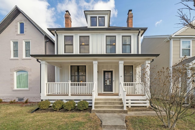 view of front of house with a porch and a front lawn