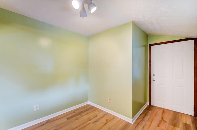 unfurnished room featuring wood-type flooring