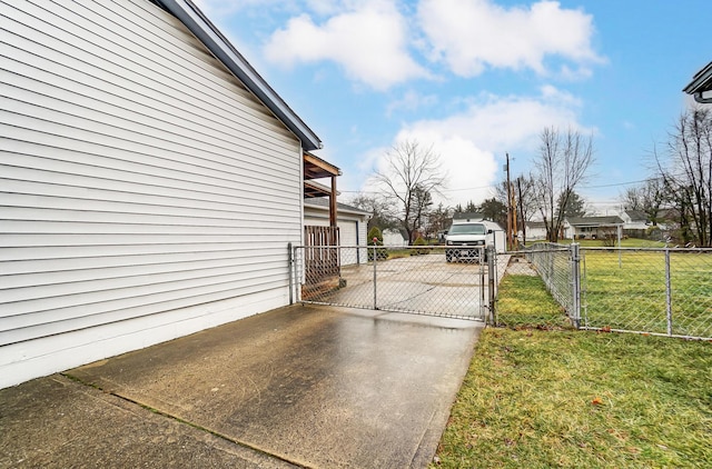 view of home's exterior with a yard and a garage