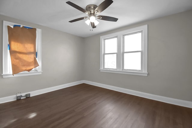 empty room featuring dark hardwood / wood-style floors and ceiling fan