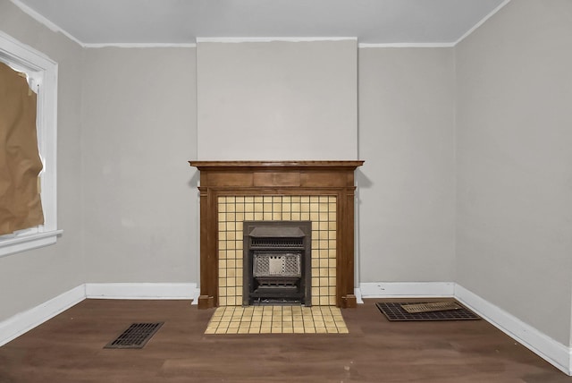 unfurnished living room with crown molding and wood-type flooring