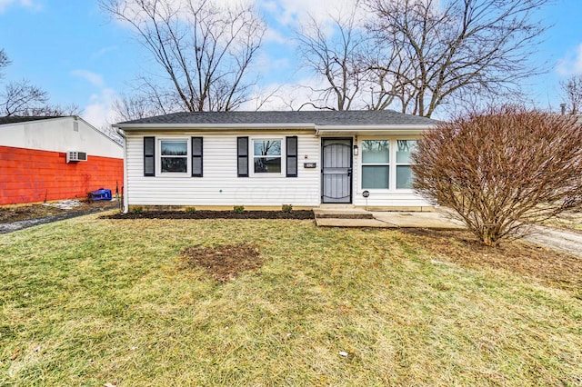 ranch-style home featuring a front lawn