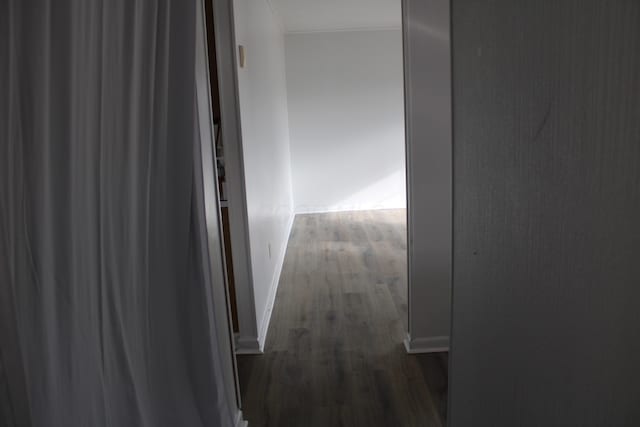 corridor with dark wood finished floors