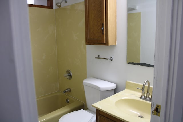 full bath featuring toilet, bathtub / shower combination, and vanity