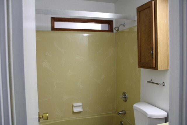 bathroom with toilet and bathtub / shower combination