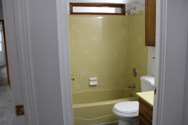 bathroom featuring toilet, shower / bath combination, and vanity