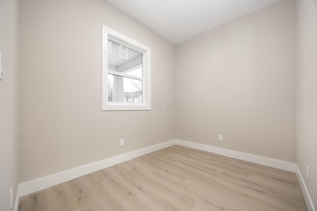 unfurnished room with light hardwood / wood-style flooring