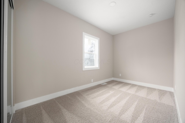 spare room with carpet floors