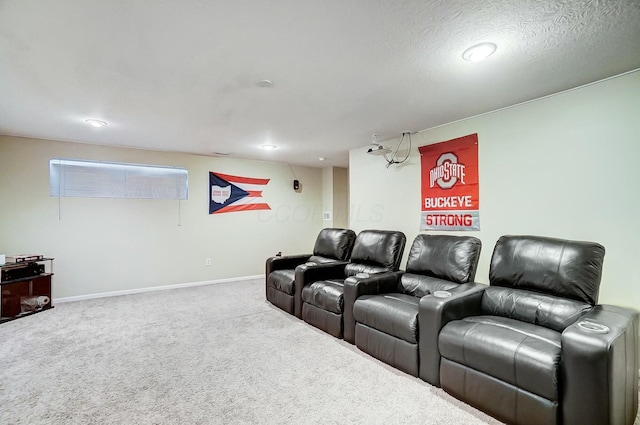 cinema room with carpet and a textured ceiling