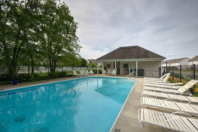 view of swimming pool with a patio area