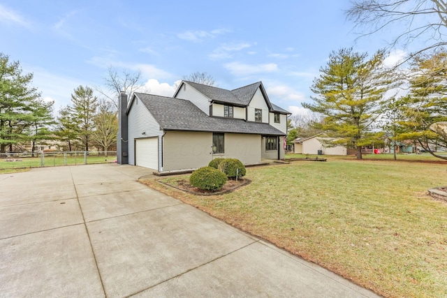 view of side of home with a garage and a yard