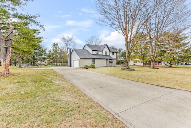 view of front of property with a garage and a front yard