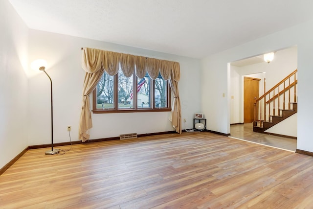 empty room featuring hardwood / wood-style flooring