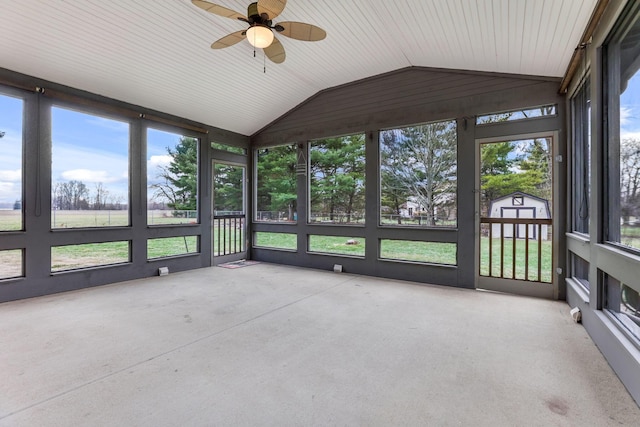 unfurnished sunroom featuring vaulted ceiling and ceiling fan