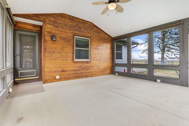 unfurnished sunroom featuring lofted ceiling and ceiling fan